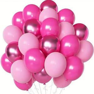 May include: A bunch of pink and metallic pink balloons. The balloons are arranged in a cluster, with some of the balloons overlapping.