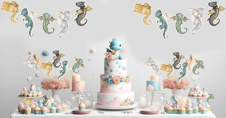 May include: A three-tiered white cake topped with a blue dragon figurine, surrounded by smaller cakes, cupcakes, and dragon-themed paper cutouts. The display features pastel-colored floral accents, pink clouds, and various dragon illustrations.