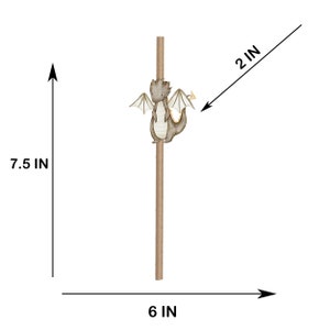 May include: A brown paper straw featuring a small, grey dragon illustration with white wings. The straw measures 7.5 inches in height, while the dragon figure measures 2 inches in width. The total width of the display area is 6 inches.