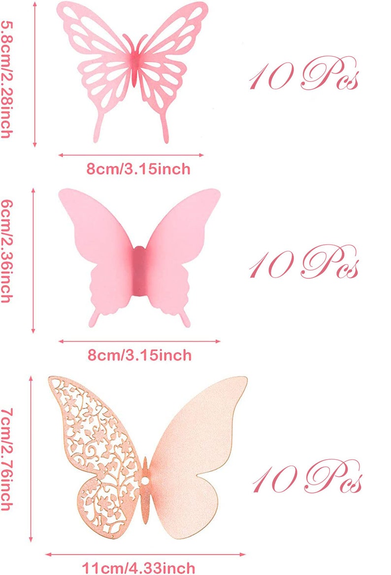 May include: A set of 10 pink and gold butterfly wall decorations. The butterflies are 5.8 cm, 6 cm, and 7 cm in size. The butterflies are made of paper and have a delicate, intricate design.