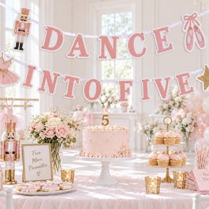 May include: A pink and white party banner featuring the text DANCE INTO FIVE with a nutcracker, ballet slippers, and a star. The banner is displayed above a table with a cake, cupcakes, flowers, and signs reading Five More Pirouettes.