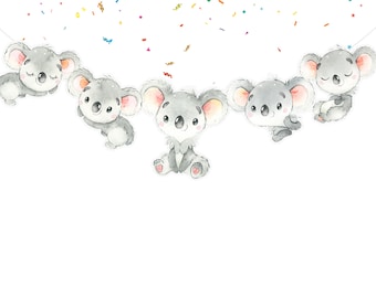 May include: A garland of five gray koala bears with pink noses and ears, hanging from a string with colorful confetti falling around them.