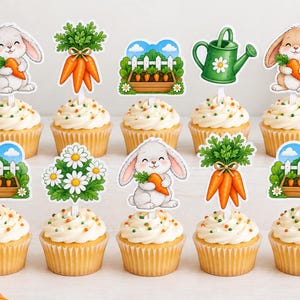 May include: A set of ten cupcakes topped with decorative paper toppers featuring illustrations of white and brown rabbits holding carrots, bunches of orange carrots, green watering cans, daisy flowers, and garden beds with white picket fences.