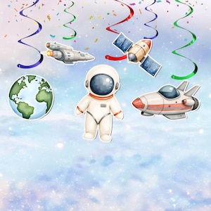 May include: A collection of space-themed decorations, including a white astronaut, a globe, a rocket, a spaceship, and a satellite. The decorations are set against a light blue background with confetti and colorful streamers.