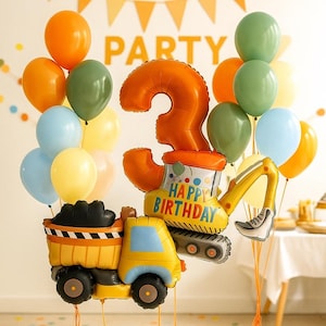 May include: A festive birthday balloon arrangement featuring a yellow and blue construction truck and excavator, a large orange number 3 balloon, and an assortment of orange, green, blue, and yellow balloons. The excavator balloon says "Happy Birthday".