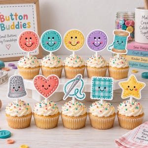 May include: Ten cupcakes topped with colorful, illustrated paper toppers featuring smiling sewing-themed characters including buttons, a spool of thread, a thimble, a heart, a needle, a square patch, and a star, all decorated with rainbow sprinkles.
