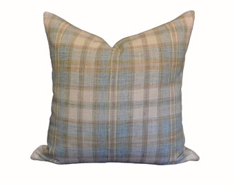 May include: A blue and white plaid throw pillow with a subtle brown pattern. The pillow is made of a soft, woven fabric.