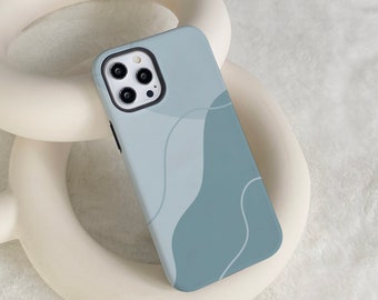 Può includere: Una custodia per telefono blu chiaro con un design astratto. La custodia ha un ritaglio per la fotocamera e uno sfondo bianco.