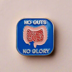 May include: A blue enamel pin with a red and pink intestine graphic and the text "NO GUTS NO GLORY".