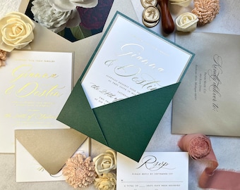 May include: A wedding invitation suite with a green envelope, a white card with gold foil lettering, and a RSVP card. The invitation reads "Gianna & Desti" and the RSVP card reads "RSVP".
