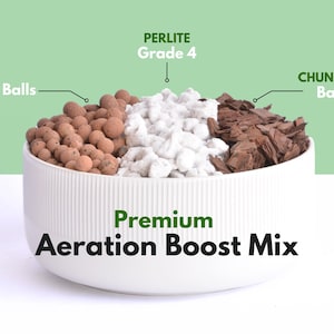 May include: A white ceramic bowl filled with a Premium Aeration Boost Mix. The mix includes Leca clay balls, perlite grade 4, and chunky bark. The text on the bowl reads "Premium Aeration Boost Mix."