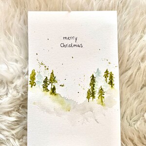 Cartolina di Natale paesaggio invernale