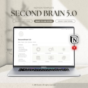 Peut inclure: Un ordinateur portable affichant un modèle Notion appelé "Second Brain 5.0", un outil de productivité pour organiser les pensées et les idées. Le modèle est conçu pour être un système prêt à l'emploi et est hautement fonctionnel. L'écran affiche une icône de cerveau, le titre "Second Brain 5.0" et une barre de navigation avec des options pour "Accueil", "Projets", "Domaines", "Ressources" et "Archives". Le modèle comprend des sections pour "Rappels", "Domaines du cerveau" et "Cerveau quotidien", avec des icônes représentant différentes fonctions du cerveau.