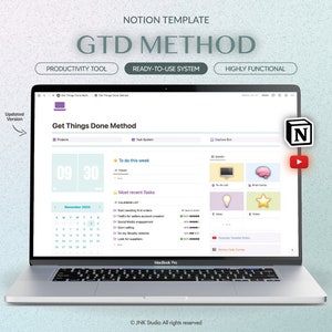 May include: A laptop computer displaying a Notion workspace with the text "Get Things Done Method" and a calendar for November 2023. The workspace is organized with sections for projects, to-do list, and most recent tasks. The Notion logo is visible in the upper right corner of the screen.