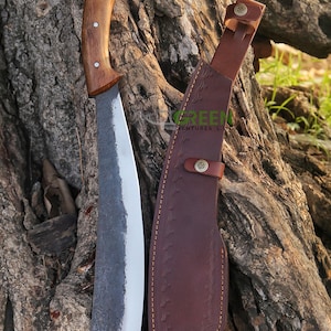 May include: A curved, black-handled machete with a brown leather sheath. The sheath has decorative stitching and a brass button.
