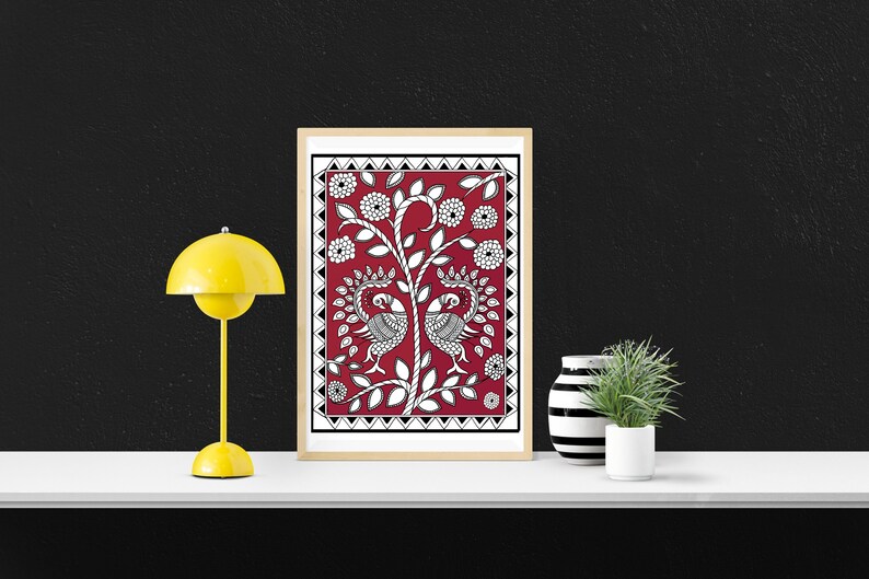 May include: A framed print of a traditional Indian folk art design featuring two peacocks on a red background with black and white details.