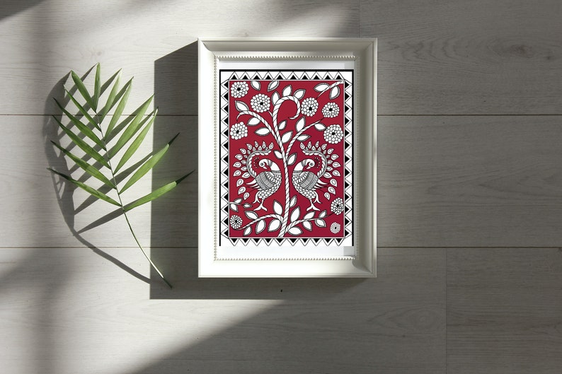 May include: Framed artwork featuring a black and white illustration of two peacocks on a red background with white flowers and leaves. The artwork is framed in a white frame.