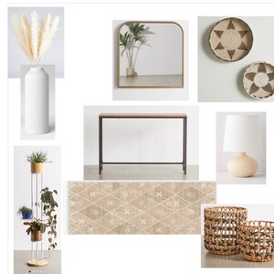 May include: A styled living room vignette featuring a white vase with dried pampas grass, a black metal console table, a woven rug, a white lamp with a beige base, two woven wall baskets, and a gold framed arched mirror.