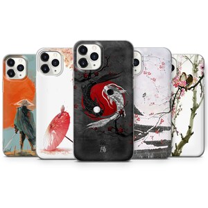 May include: Set of five phone cases featuring different Japanese-inspired designs. One case has a black and white yin yang symbol with two fish, another has a red and white umbrella, another has a black and white landscape with a bird, another has a black and white landscape with a bird and flowers, and another has a black and white landscape with a bird and flowers.