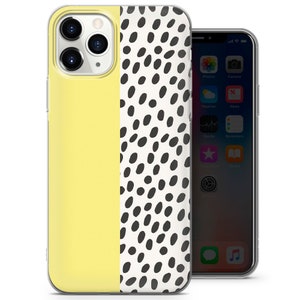 Puede incluir: Una funda transparente para tel&eacute;fono con un dise&ntilde;o amarillo y blanco. La funda tiene un patr&oacute;n de lunares negros y blancos en el lado derecho y un color amarillo s&oacute;lido en el lado izquierdo. La funda est&aacute; dise&ntilde;ada para un iPhone.