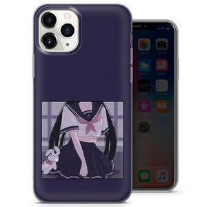 May include: A clear phone case with a purple background and a graphic of an anime girl wearing a sailor uniform and holding a stuffed bunny. The girl has long black hair and is wearing a white shirt with a red bow tie. The case is designed for an iPhone.