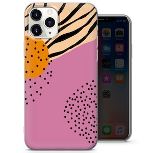 Puede incluir: Una funda para iPhone rosa, negra y naranja con un patr&oacute;n geom&eacute;trico. La funda presenta un dise&ntilde;o de rayas de cebra, lunares negros y un c&iacute;rculo naranja grande con lunares negros.