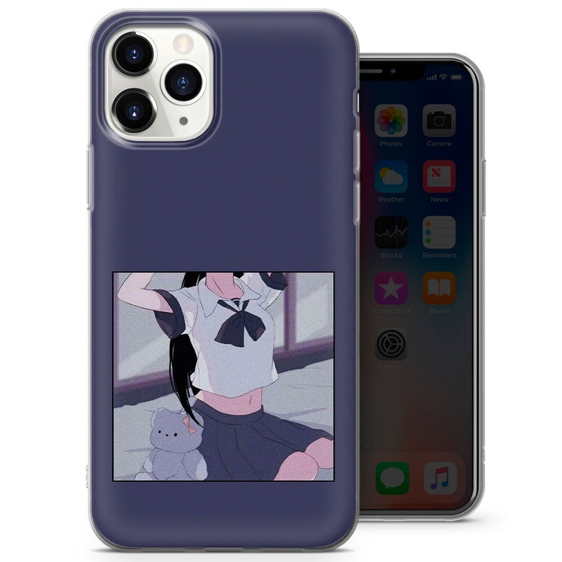 May include: A phone case with a dark blue background and a picture of an anime girl in a school uniform with a teddy bear. The girl is wearing a white shirt with a black bow tie and a black skirt. The picture is surrounded by a white border.