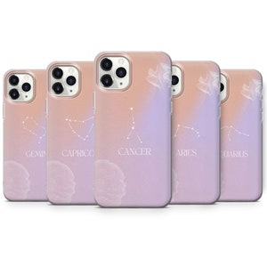 May include: Five different phone cases with a gradient background and a constellation design. The constellations are Gemini, Capricorn, Cancer, Aries, and Aquarius. The cases are clear and show the phone's camera lens.