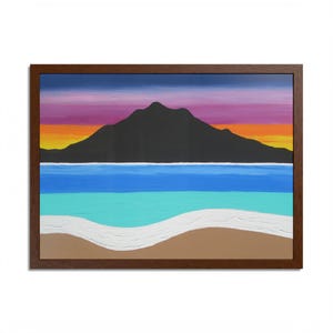May include: A framed landscape painting showing a mountain silhouette against a sunset sky. The painting features layers of blue and turquoise water, a white wave, and a sandy beach. The frame is dark brown.