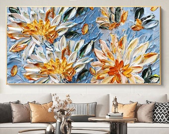 May include: A painting of white and yellow flowers with blue and green leaves on a blue background.