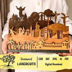 May include: A laser cut wooden design depicting the Stations of the Cross. The design features a layered scene with figures of Jesus and his followers. The design is available for digital download in CDR, DXF, SVG, AI, and PDF formats.  Treasures Lasercuts.