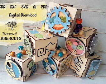 May include: Six wooden activity cubes with various textures and activities, including gears, beads, and a maze. The cubes are stacked on top of each other and are made of natural wood. The image includes the text "CDR DXF SVG AI PDF Digital Download Treasured Lasercuts".