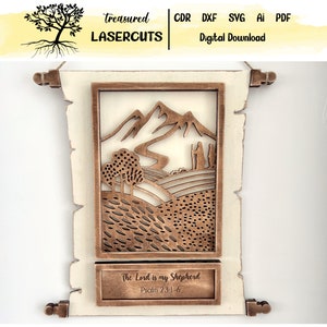 May include: A wood cutout of a mountain landscape with a quote from Psalm 23:1-6, "The Lord is my Shepherd", in a scroll-like frame. The frame is white with a distressed look and the cutout is a brown wood.