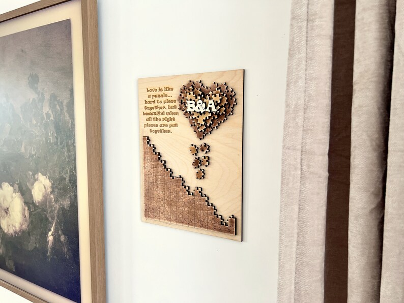 May include: A wooden heart-shaped puzzle with the letters "B&A" in the center. The puzzle is surrounded by a quote about love being like a puzzle, hard to place together, but beautiful when all the right pieces are put together.