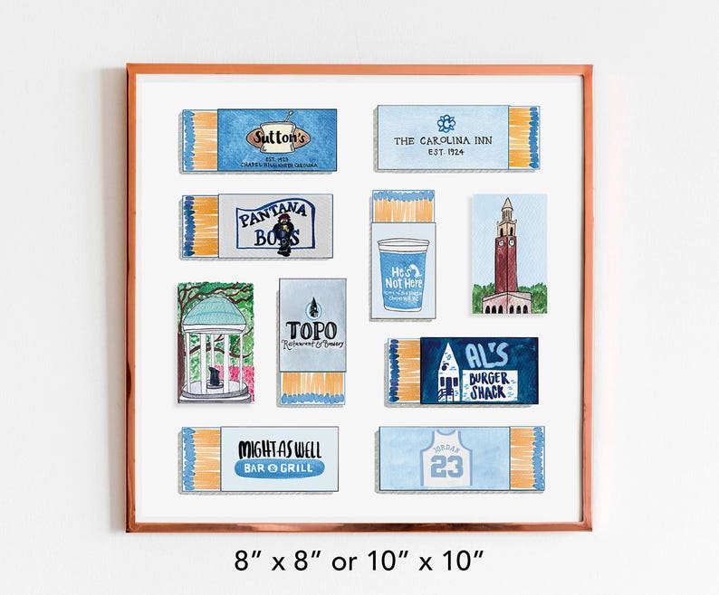 May include: A framed print of nine matchbox labels, each featuring a different design. The labels are all blue and white, and they feature various local businesses and landmarks. The frame is a light brown wood.