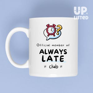 May include: White ceramic mug with a handle, featuring the text "Official member of ALWAYS LATE club *" in black and blue. The mug has a graphic of a red alarm clock and a yellow question mark.