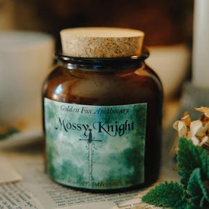 May include: A white ceramic mug with a black handle and the text "But First, Coffee" in a handwritten style. The mug is on a white surface. The mug is 4 inches tall.