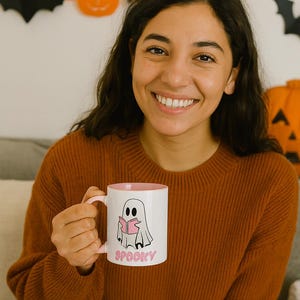Spooky Ghost Reading Mug  Cute Halloween Coffee Cup with Pink Book   Pink Handle, Cozy Fall Gift for Bookworms, Teachers White Pink details