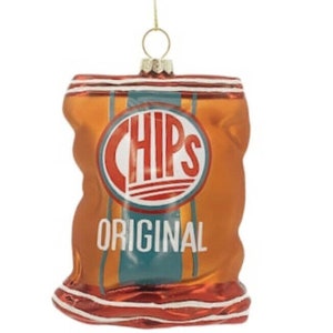 May include: Orange and teal Christmas ornament shaped like a bag of chips. The ornament has a gold hanger and features the word "CHIPS" in a red and white circle, with "ORIGINAL" below.