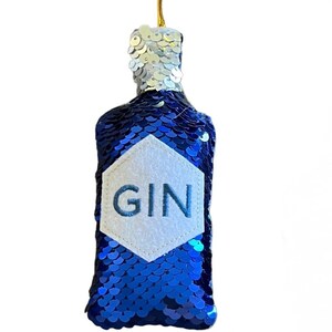 May include: Blue sequin gin bottle ornament with a white felt label that says "GIN".