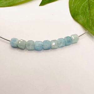 Blue aquamarine cubes on a steel cable necklace