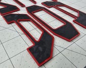 thumbnail image 2 of AFX-TRIMS 3D Black Red Outline Raised Domed Tailgate Letters For Toyota Tacoma 2024-2025 2 of 4