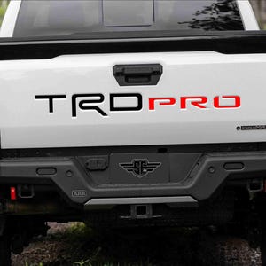 2024-25+ TACOMA TRD PRO Tailgate Insert Letters (Plastic Carbon Forged Look/Red)(Black Satin), (Black Gloss)