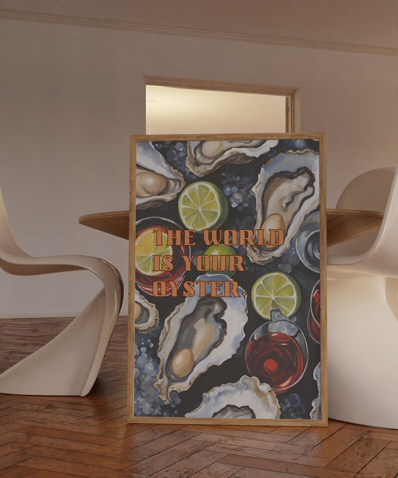 May include: A framed art print featuring a dark background with illustrations of oysters, lime slices, and glasses of red liquid. The text "THE WORLD IS YOUR OYSTER" is displayed in orange letters.