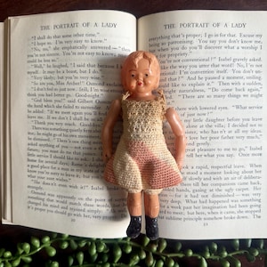 Vintage Celluloid Strung Doll with a Crochet Dress