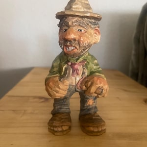 Caricature wood carving of a hillbilly hobo figure