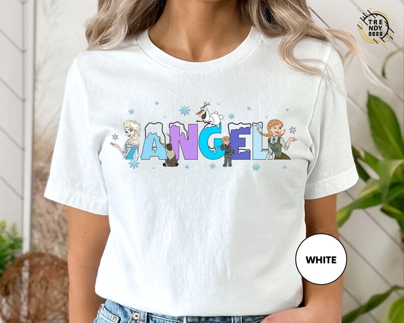 a woman wearing a white t - shirt with the word angel on it