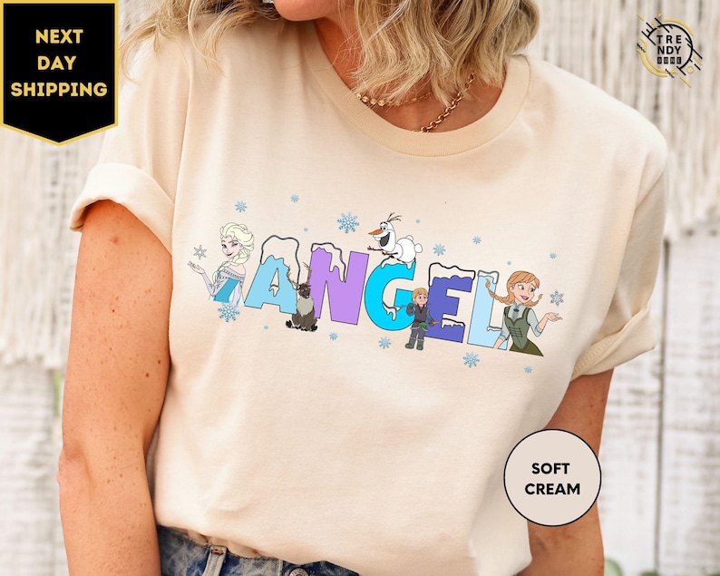 a woman wearing a t - shirt with the word angel printed on it