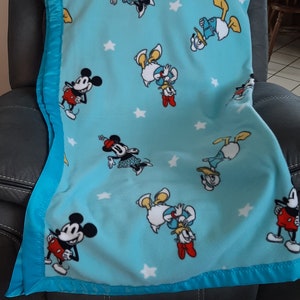 Mickey and Minnie Mouse, Donald and Daisy Duck, Kids Fleece Blanket with matching light blue or a bright blue satin trim