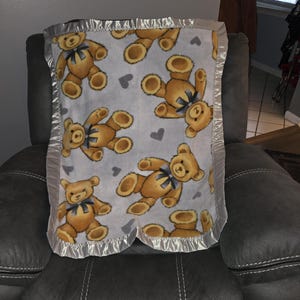 Teddy Bears on a gray background, Infant Crib Fleece Blanket with a matching gray satin trim